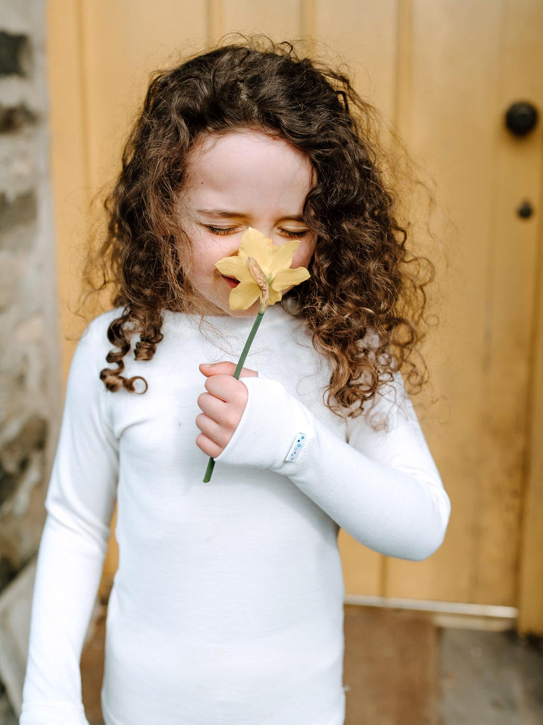 Merino wool kids thermal baselayer pyjama top in white #colour_pure-ivory