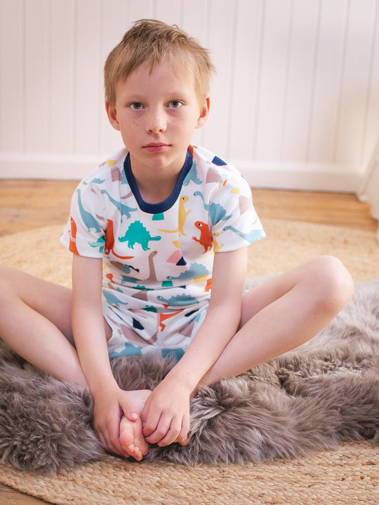 organic cotton kids shortie pyjama PJ sitting #colour_dinosaurs