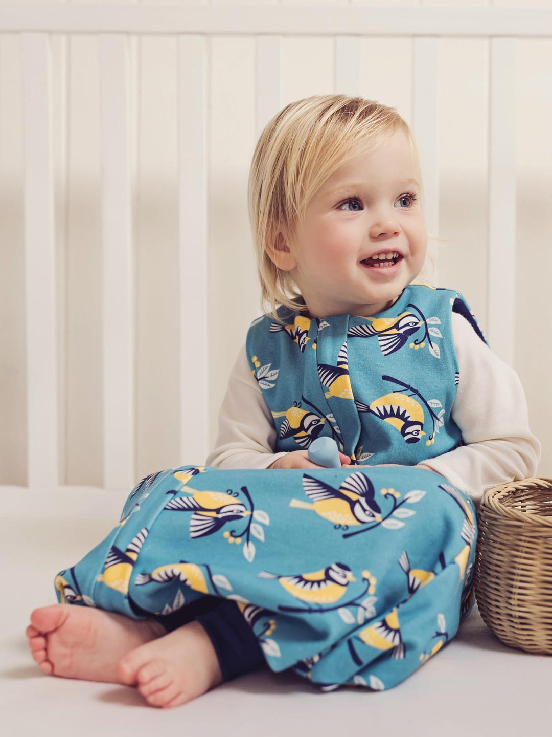 Merino toddler sleeping bag with feet bird print sitting #colour_blue-tit