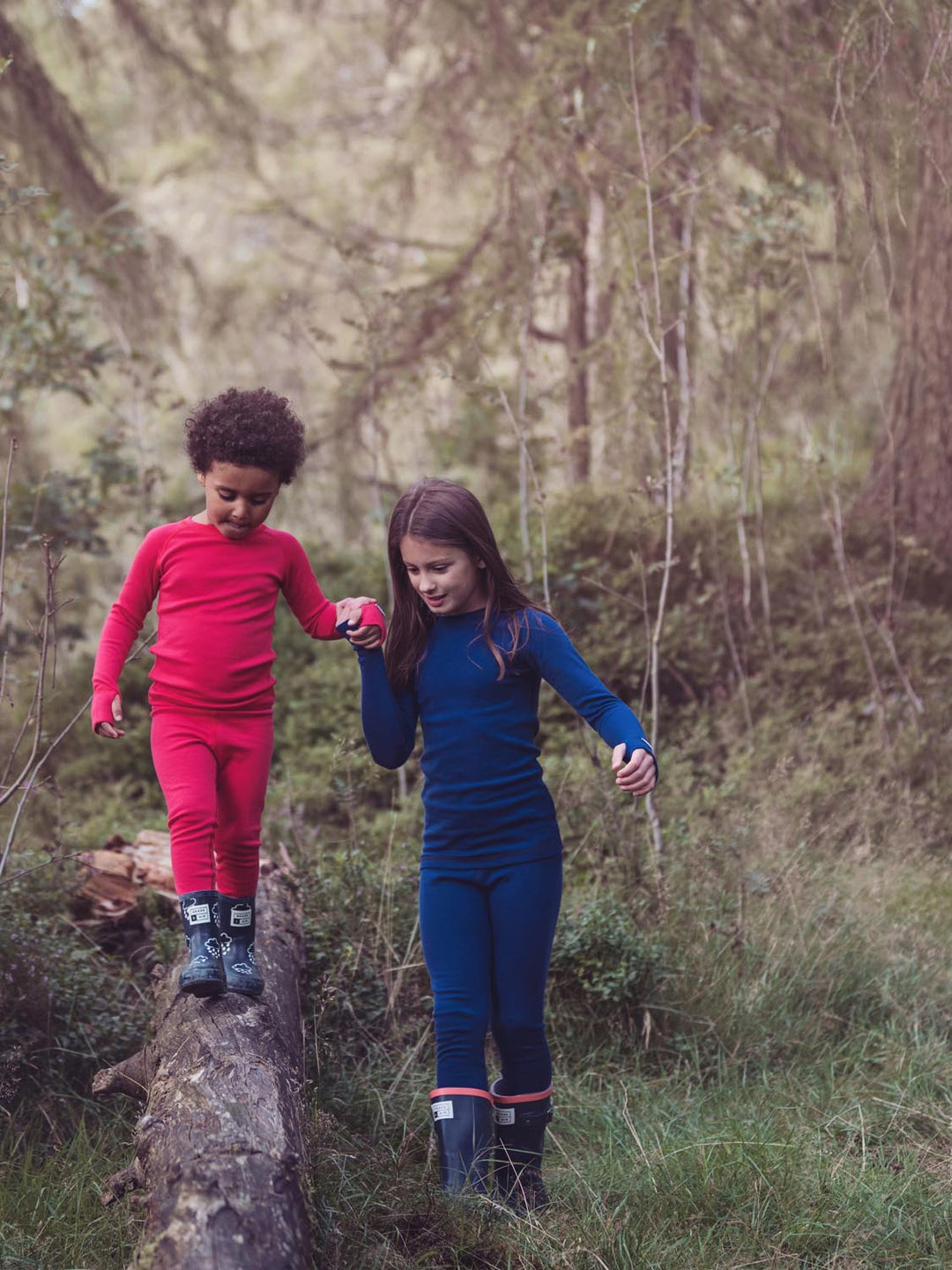 Merino wool kids thermal baselayer pyjama set in navy & red #colour_french-navy