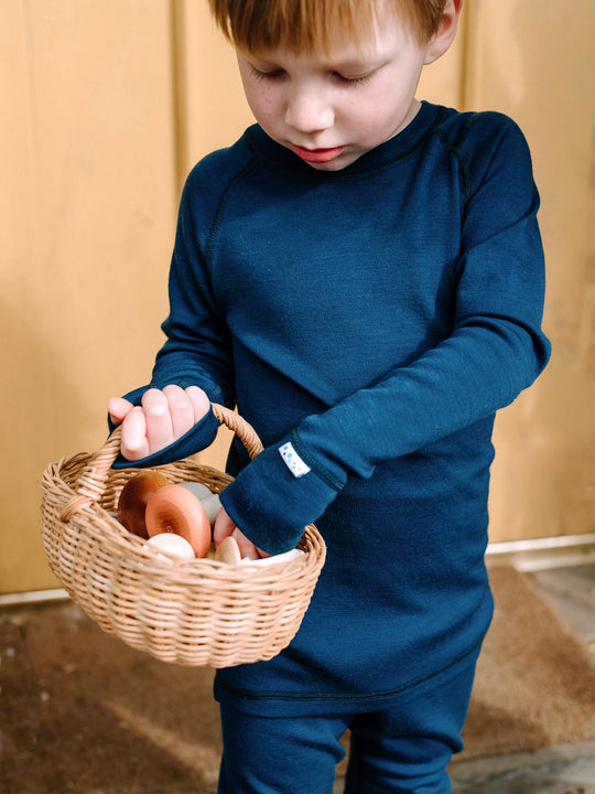 Merino wool kids thermal baselayer pyjama top detail in navy #colour_french-navy