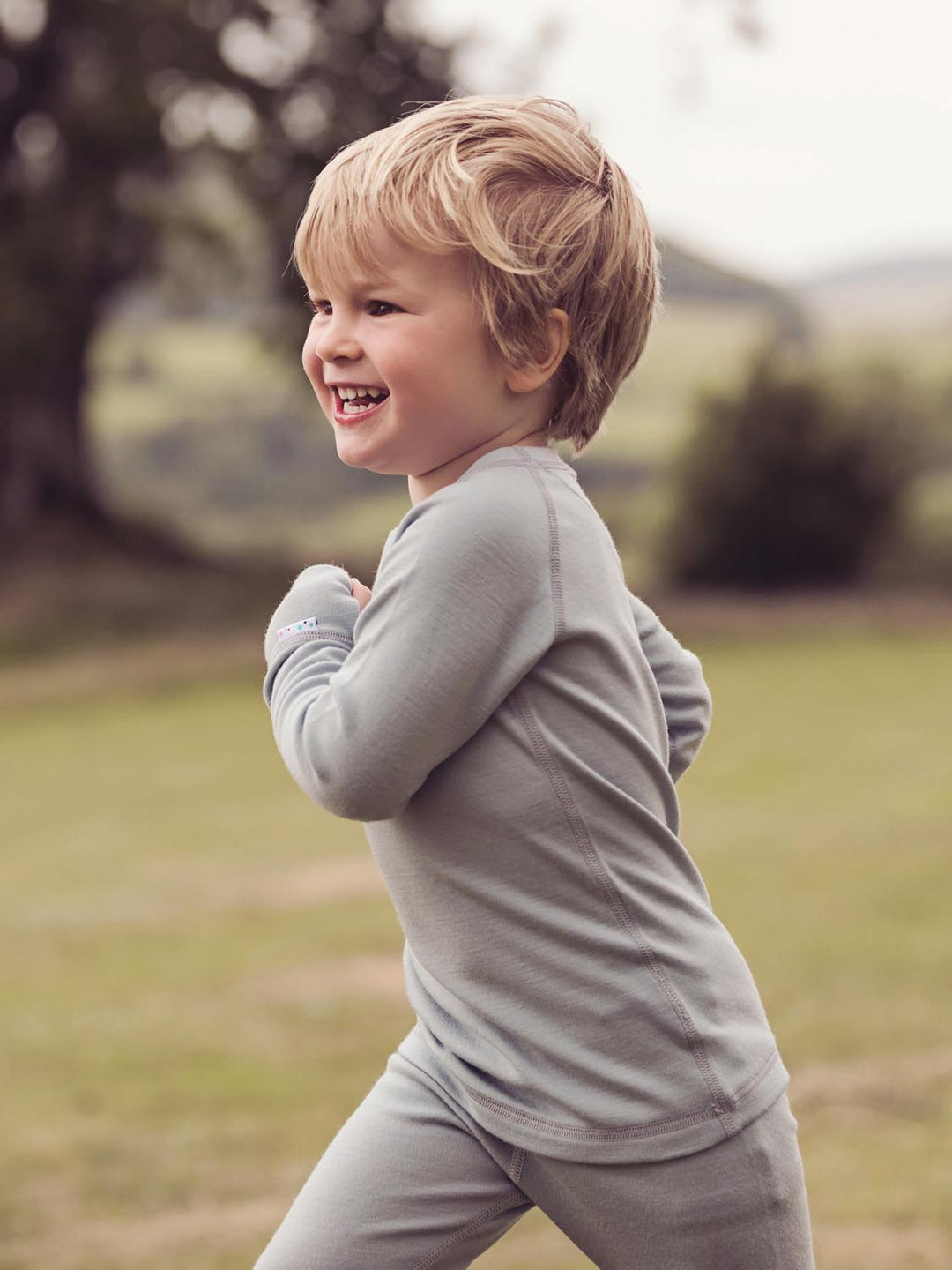 Merino wool kids thermal baselayer pyjama in grey side #colour_cloud-grey