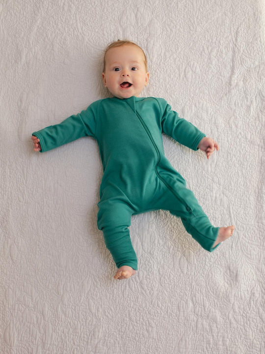 merino baby sleepsuit green front #colour_wild-green