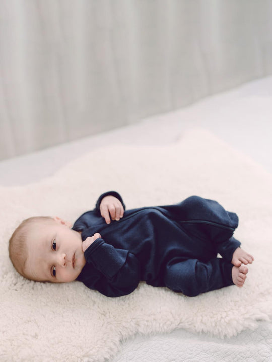 merino baby sleepsuit navy front #colour_french-navy