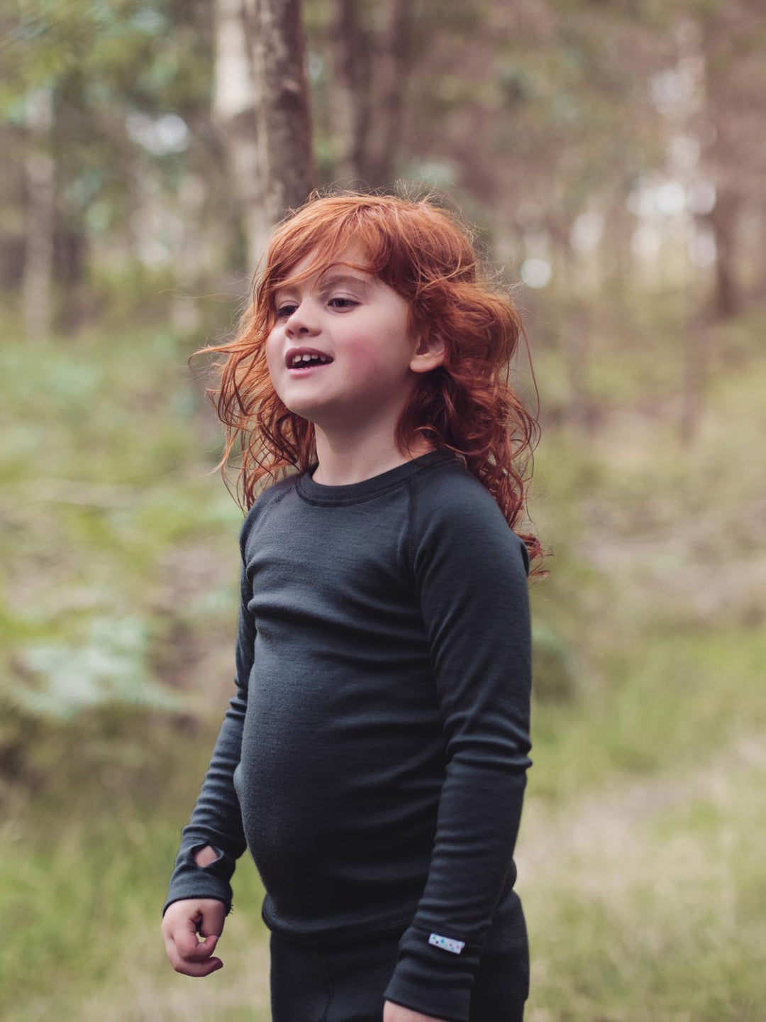 Merino wool kids thermal baselayer pyjama in black top #colour_ink