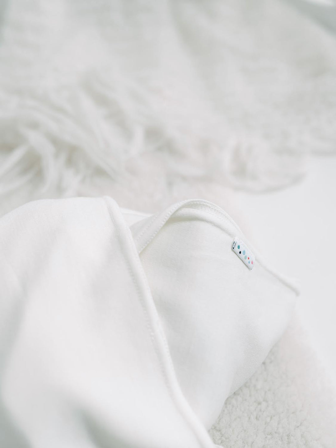 merino newborn baby swaddle ivory detail #colour_pure-ivory