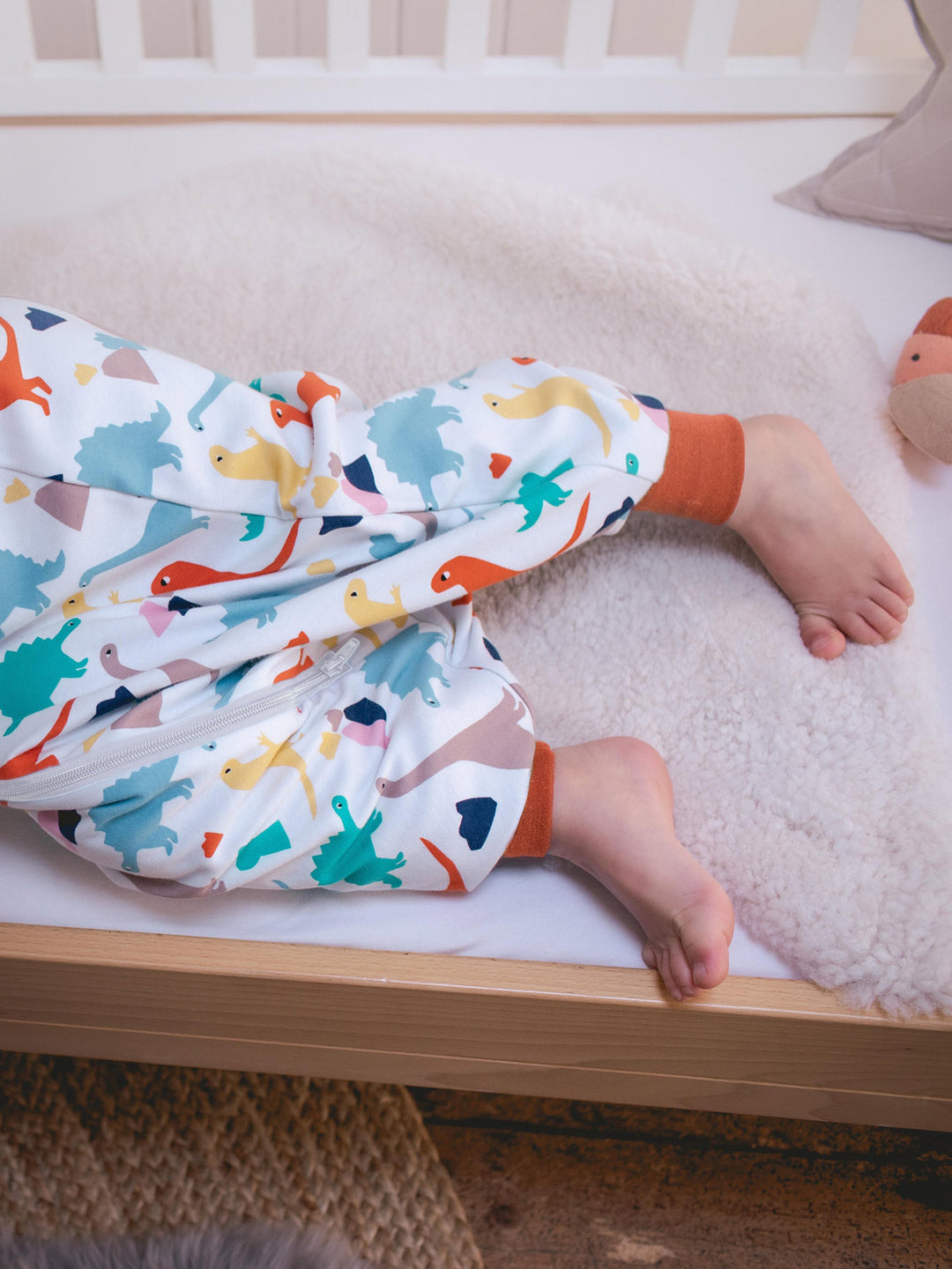 Merino toddler sleeping bag with feet dinosaur print foot holes #colour_dinosaurs