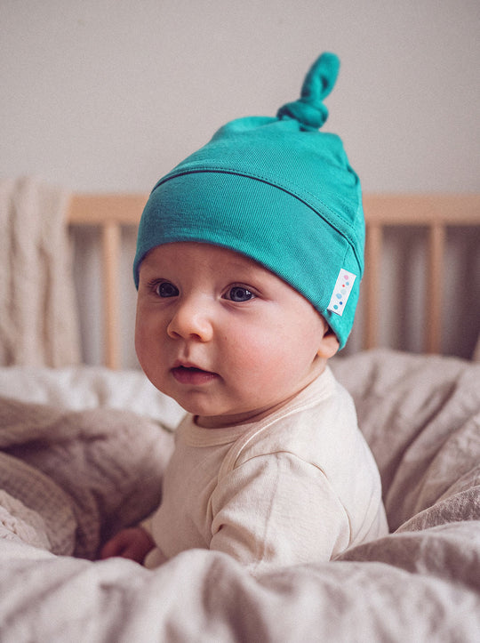 Merino baby hat green close #colour_wild-green