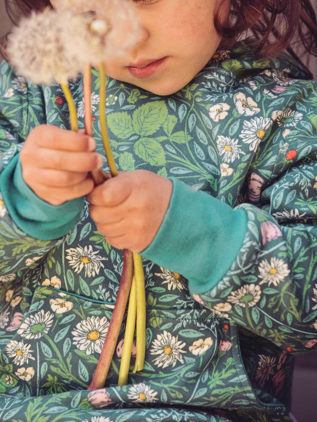 Kids Merino Reversible Hoody Superlove Merino  floral green closeup #colour_secret-garden