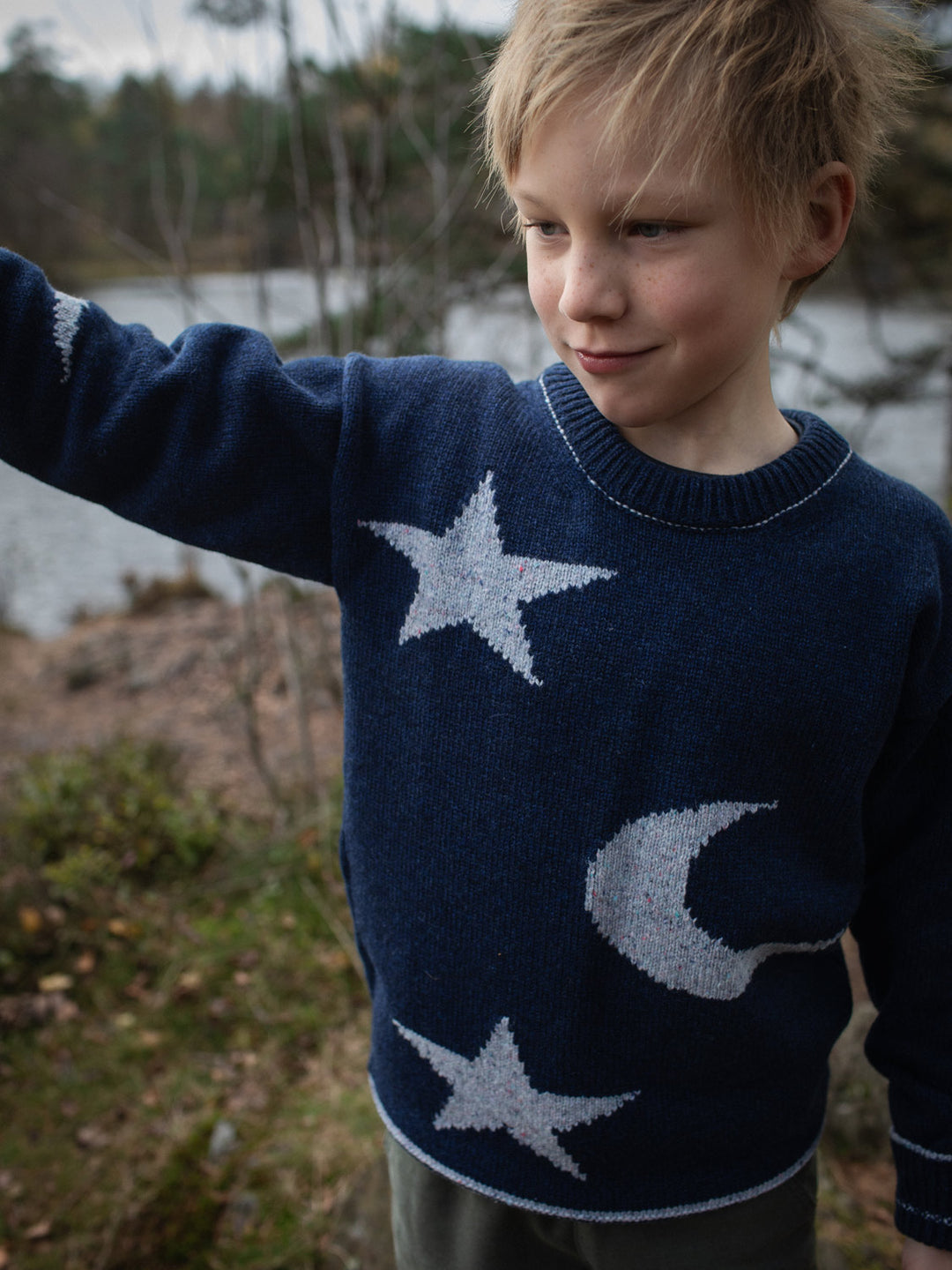 Navy blue merino wool kids knitted sweater gift hand knitted with star and moon design #colour_nocturne