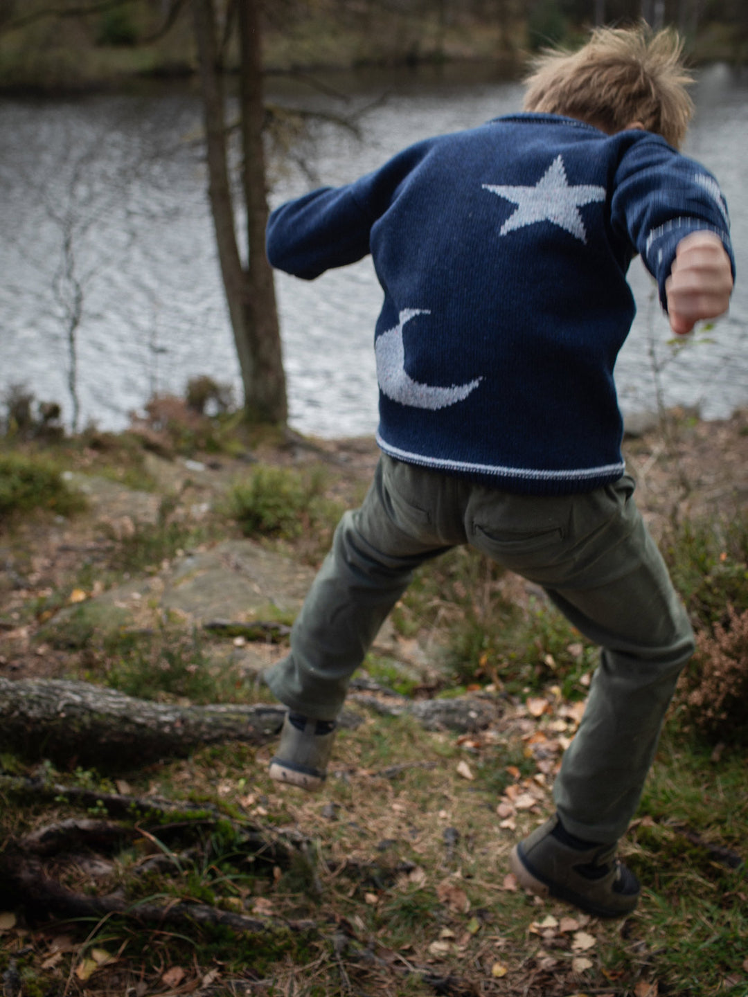 Navy blue merino wool kids knitted sweater gift hand knitted with star and moon design back #colour_nocturne