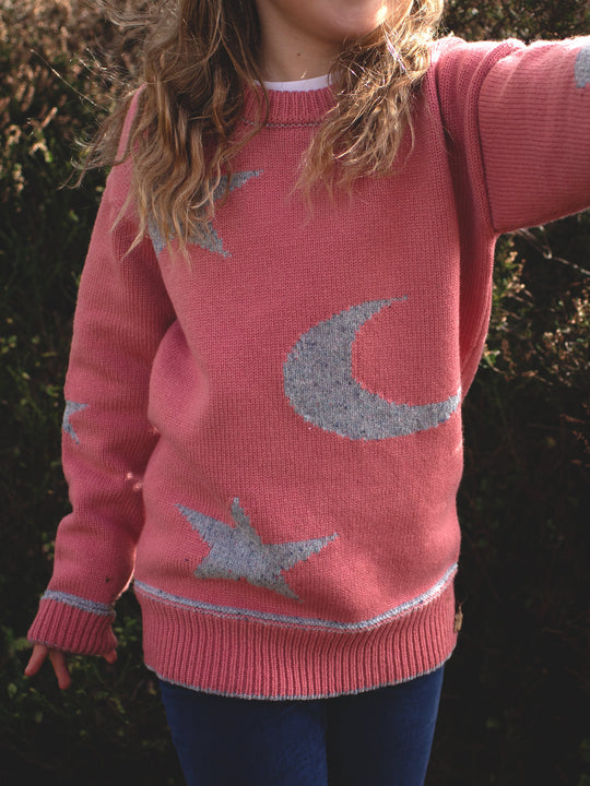pink girls merino wool baby toddler and kids knitted sweater gift hand knitted with star and moon design close up #colour_aurora
