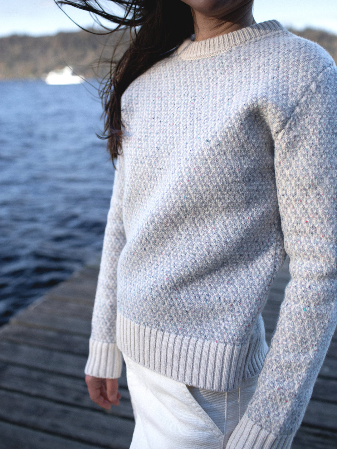 Merino wool womens crew neck jumper sweater knit in neutral grey and white ivory tones close view #colour_glacial-quartz