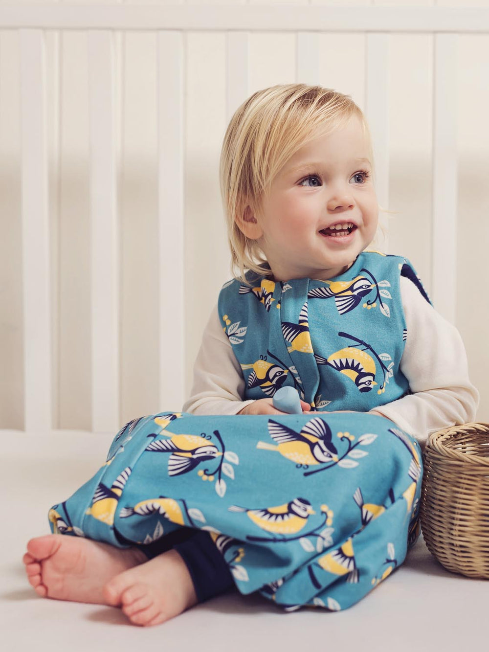 Merino toddler sleeping bag with feet bird print sitting #colour_blue-tit