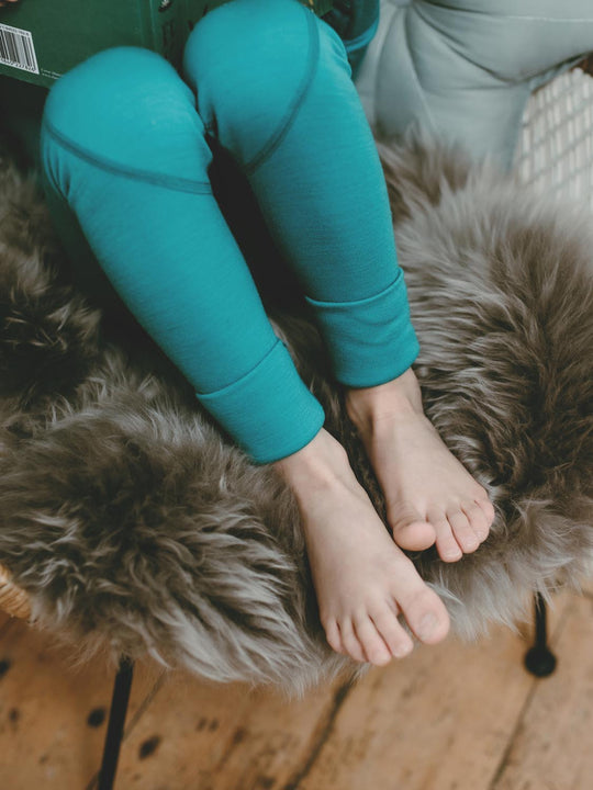 Merino wool kids thermal baselayer pyjama set foot cuff green #colour_wild-green