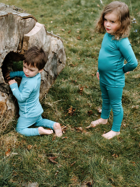 Merino wool kids thermal baselayer pyjama set side green #colour_wild-green