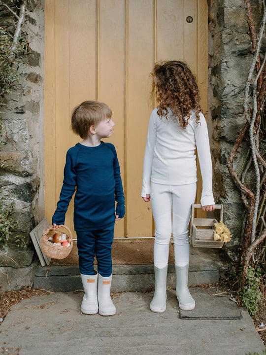 Merino wool kids thermal baselayer pyjama set in navy & White #colour_french-navy
