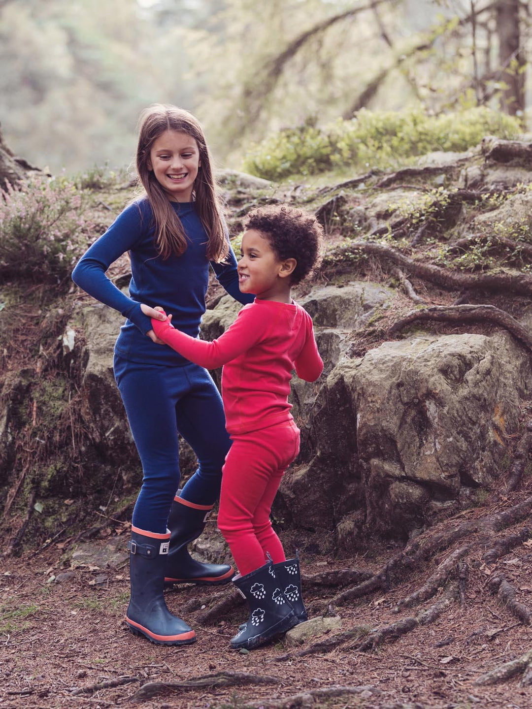 Merino wool kids thermal baselayer pyjama set in navy red side #colour_soft-red