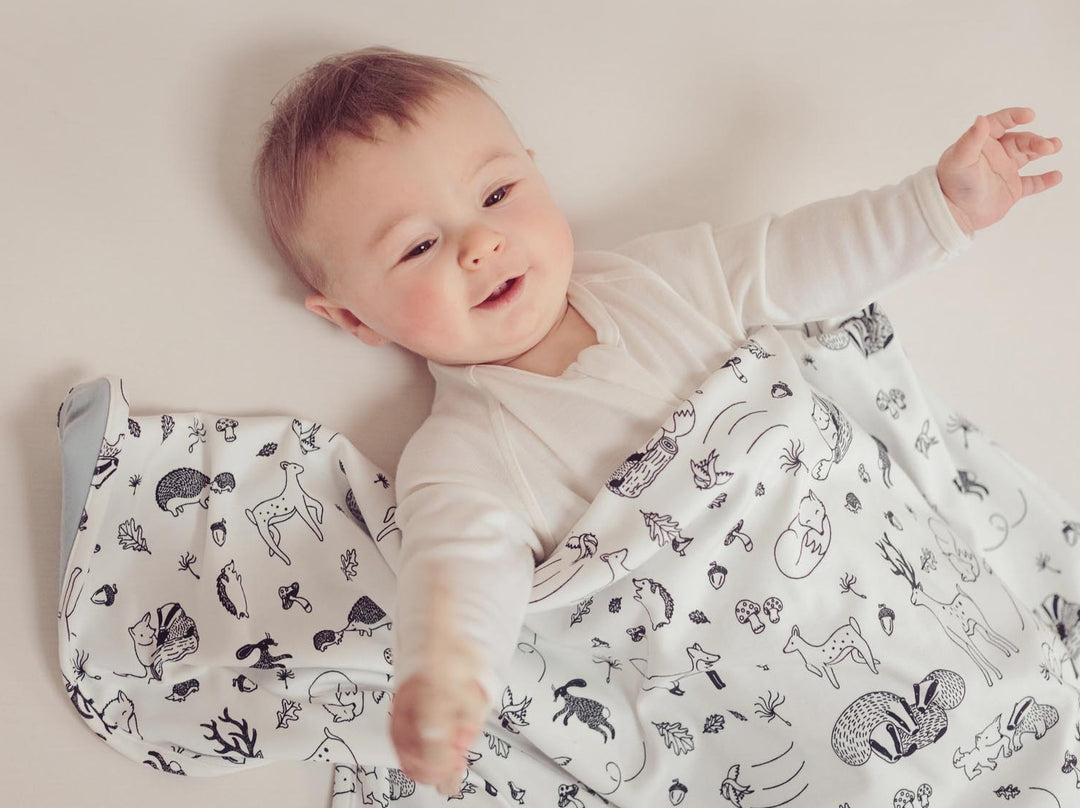 merino baby cot blanket woodland animals front  #colour_enchanted-forest