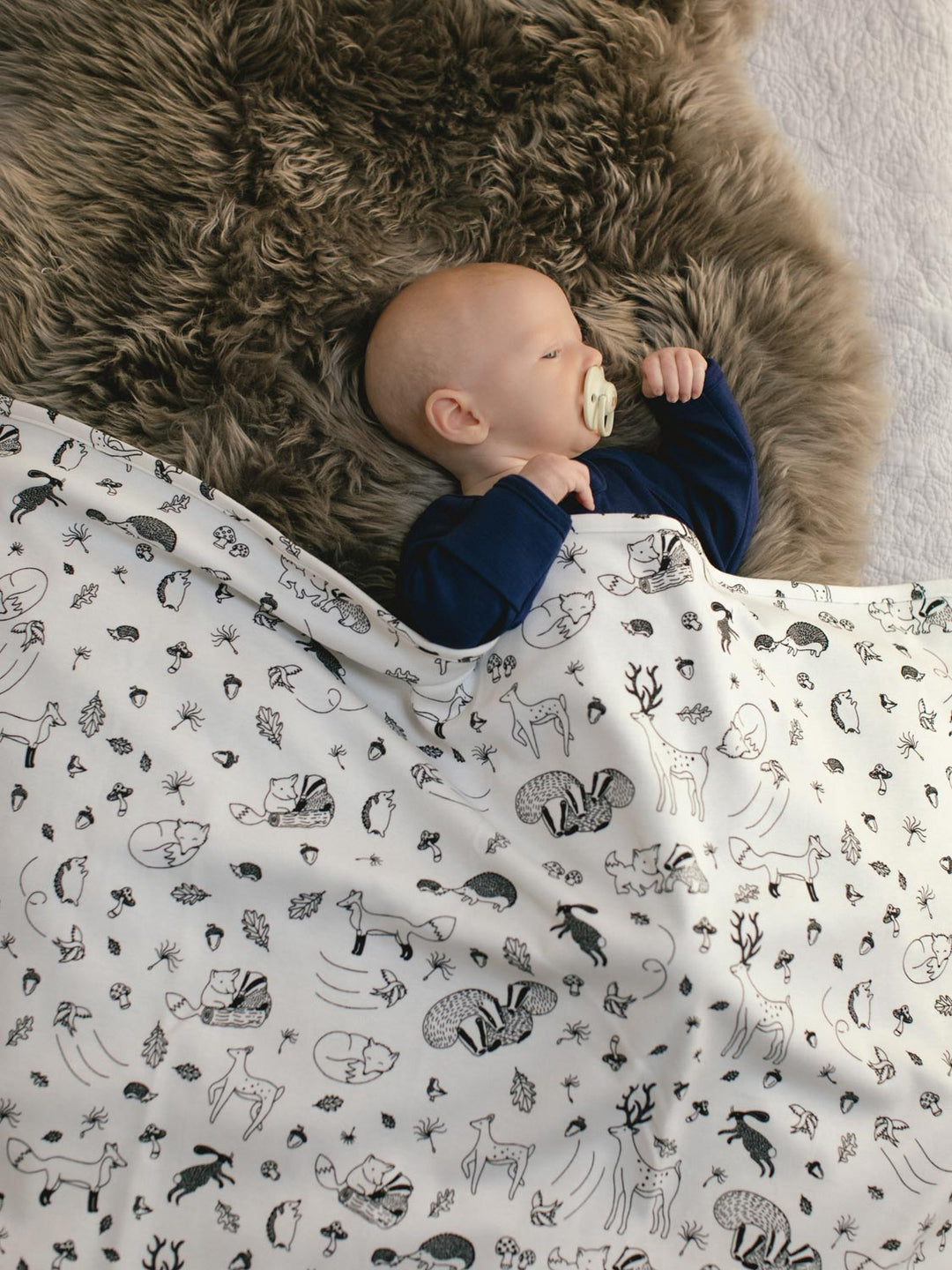 merino baby cot blanket woodland animals side #colour_enchanted-forest