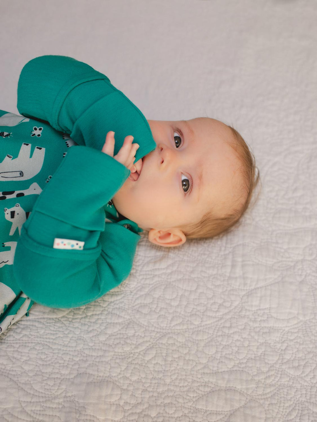 Merino baby sleeping bag arms green close #colour_wild-green