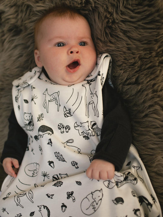baby merino sleeping bag with woodland animal print  closeup #colour_enchanted-forest