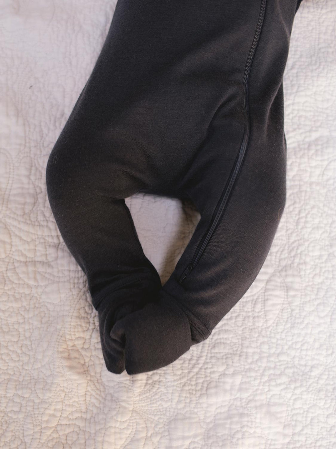 merino baby sleepsuit black covered foot #colour_ink