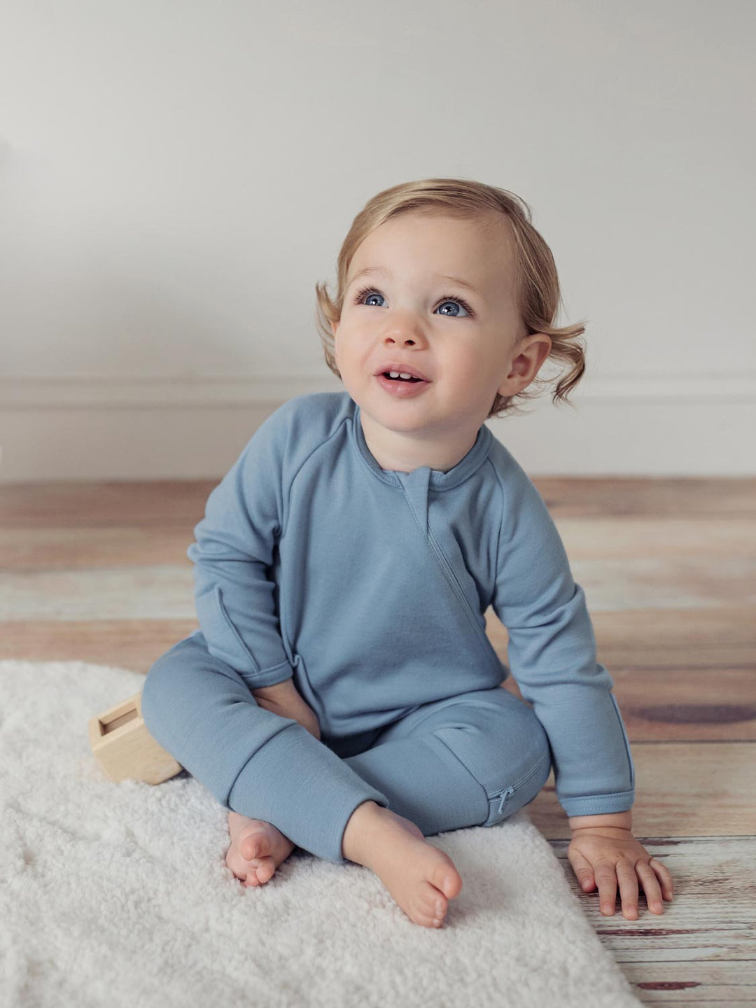 merino baby sleepsuit blue front #colour_lake