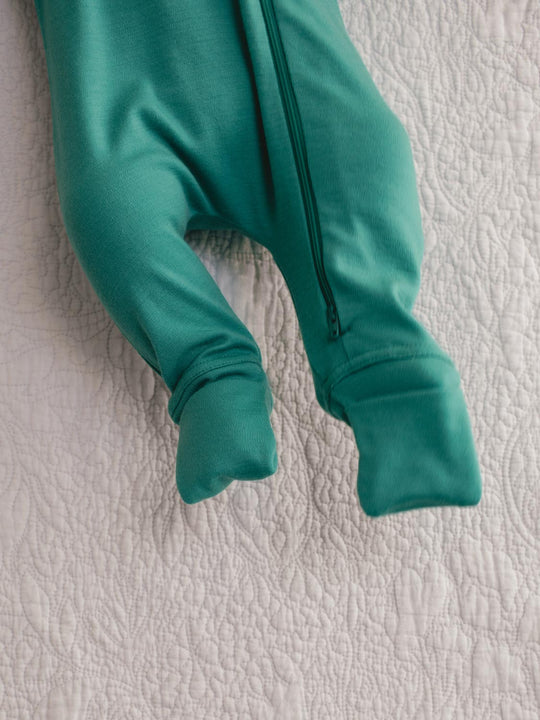 merino baby sleepsuit green feet #colour_wild-green