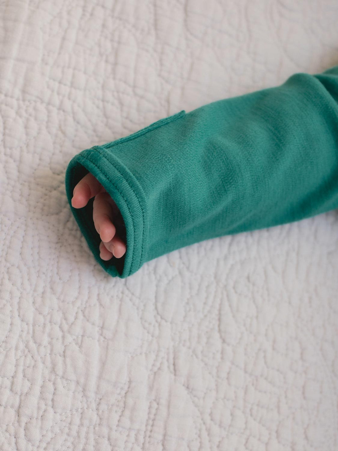 merino baby sleepsuit green hand #colour_wild-green