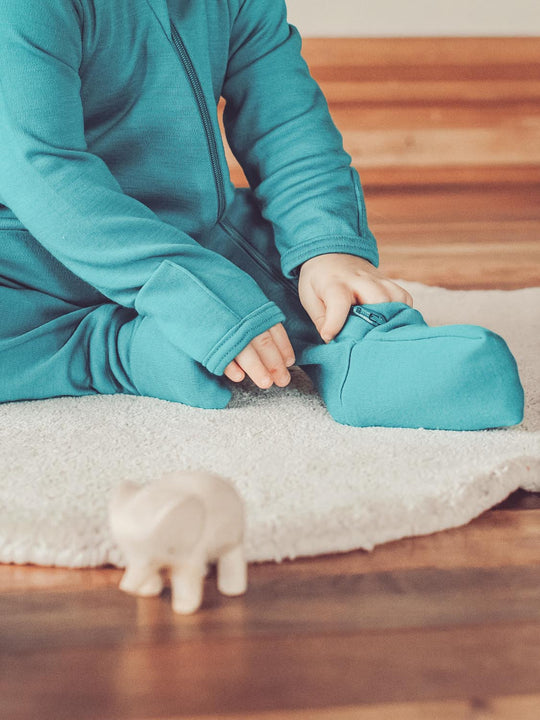 merino baby sleepsuit green zip footed #colour_wild-green