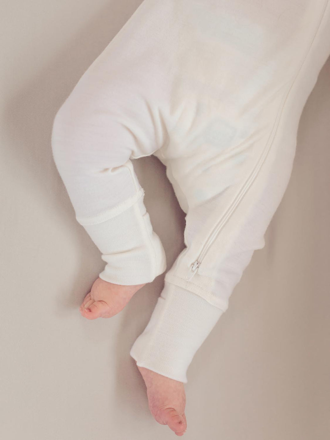 merino baby sleepsuit white feet #colour_pure-ivory