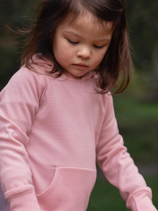 Kids merino hoodie pink closeup #colour_vintage-rose