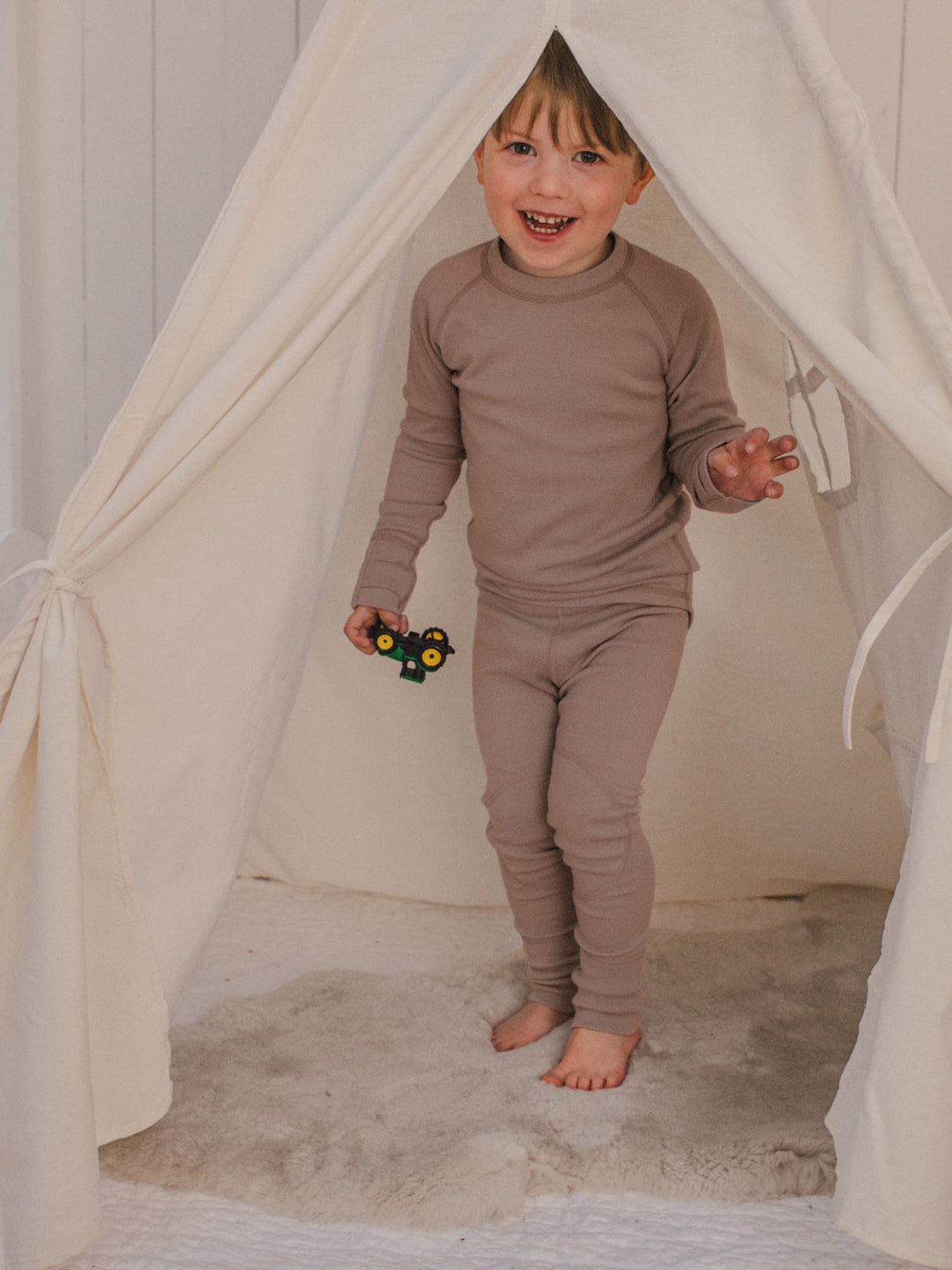 Merino wool kids thermal baselayer pyjama in neutral beige front #colour_pebble