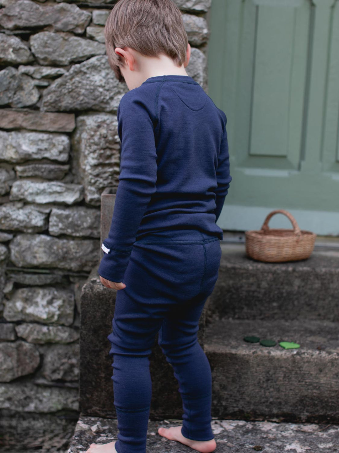 Merino wool kids thermal baselayer pyjama set in navy rear #colour_french-navy