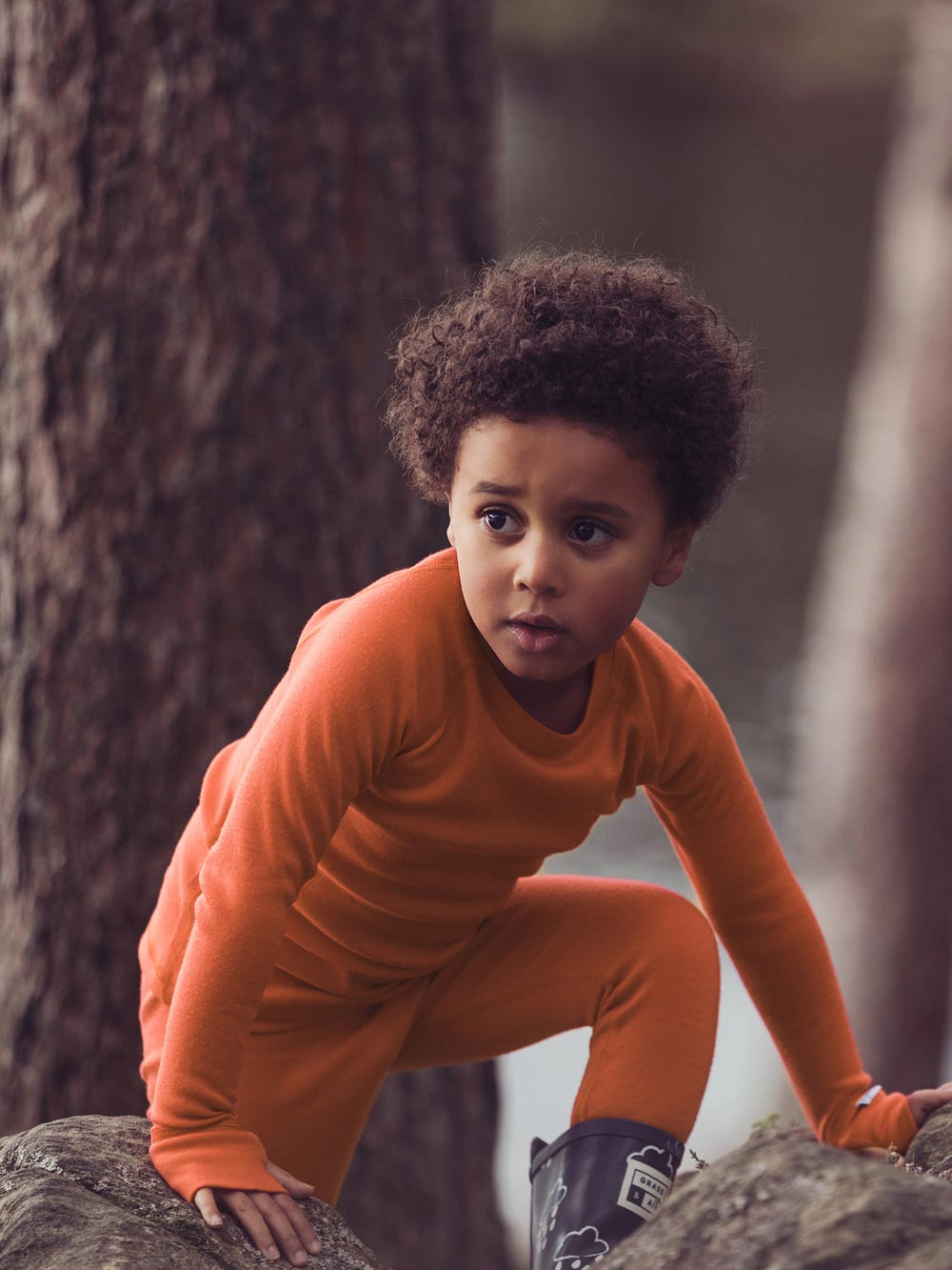 Merino wool kids thermal baselayer pyjama action in orange #colour_fox