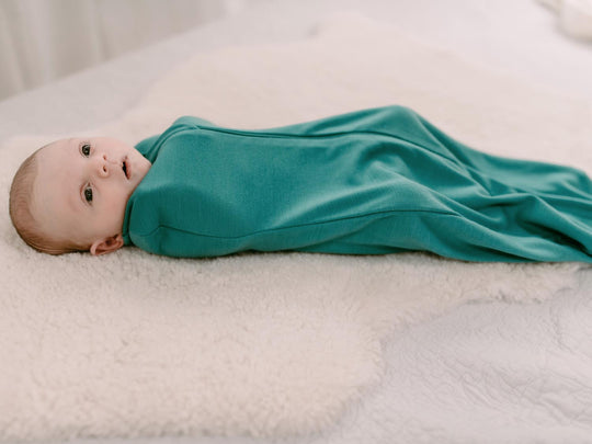 newborn baby merino zip swaddle green side #colour_wild-green