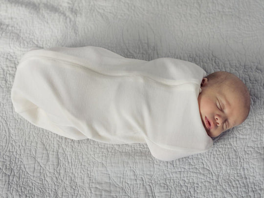 newborn baby merino zip swaddle white side #colour_pure-ivory